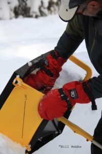 Packing snow into the ICEBOX Igloo Tool